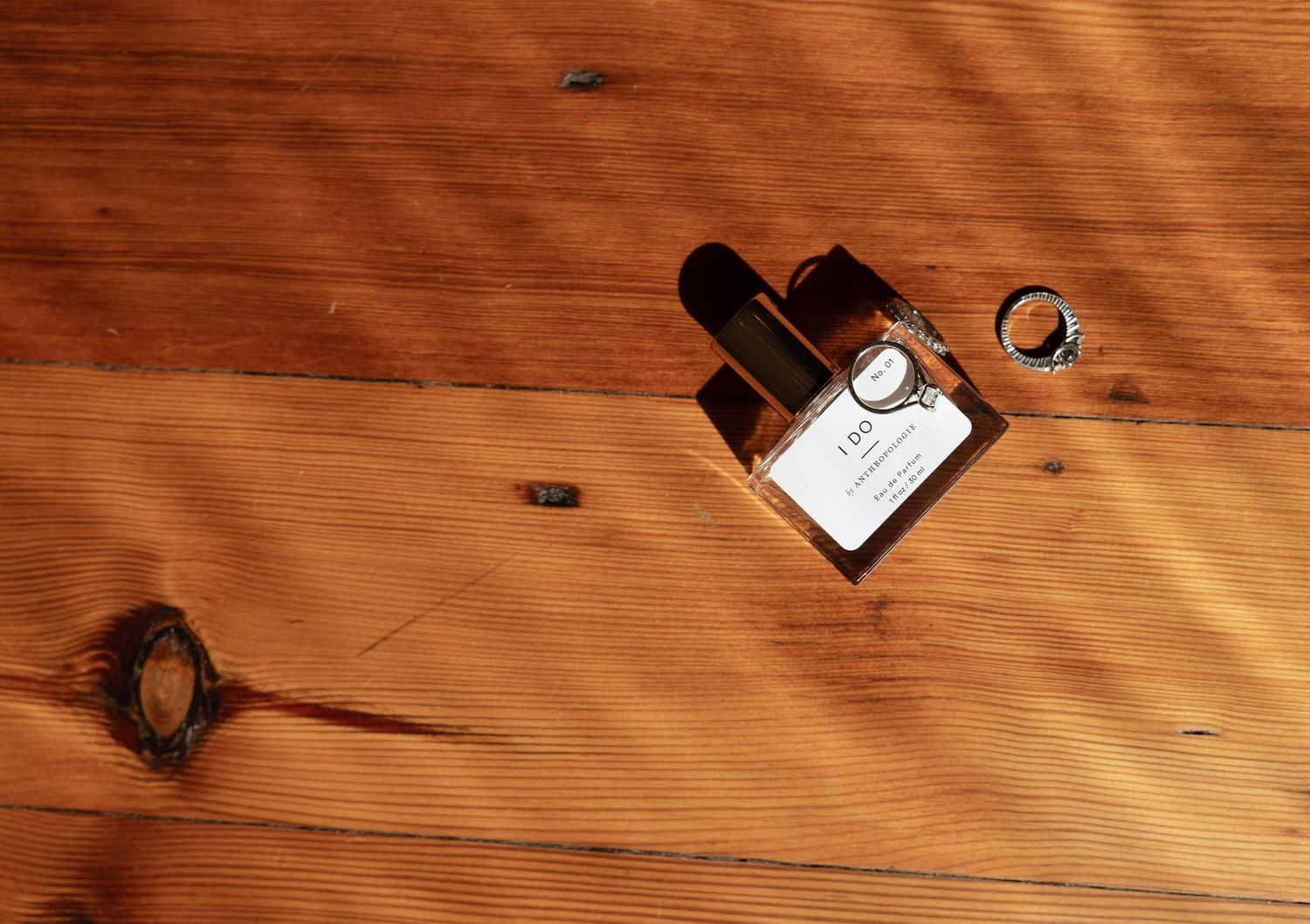Rustic wooden boards with natural grain patterns under warm directional lighting.