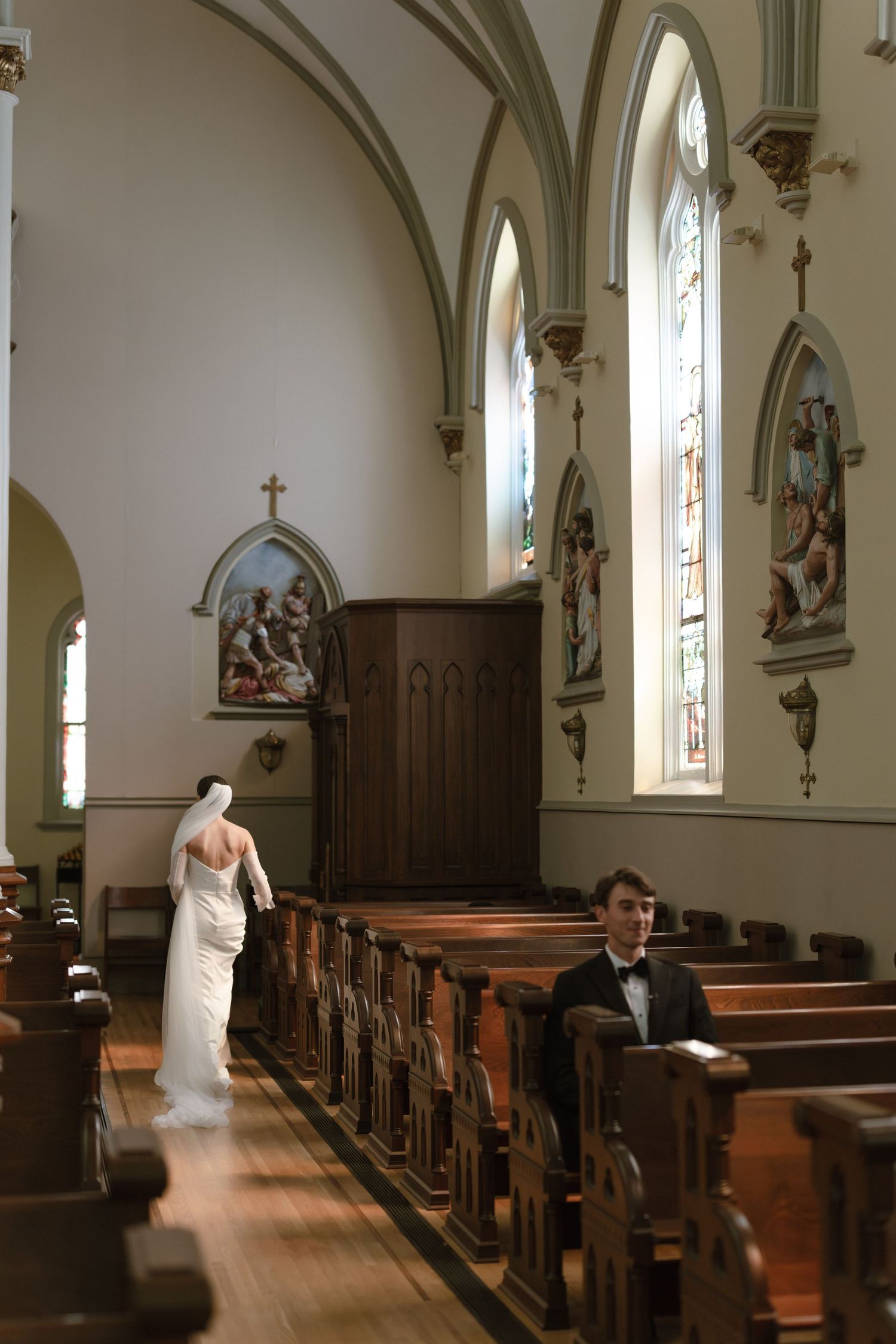 A sequence of photos showing a bride in a white dress walking through the sunlit aisle of a traditional church sanctuary.