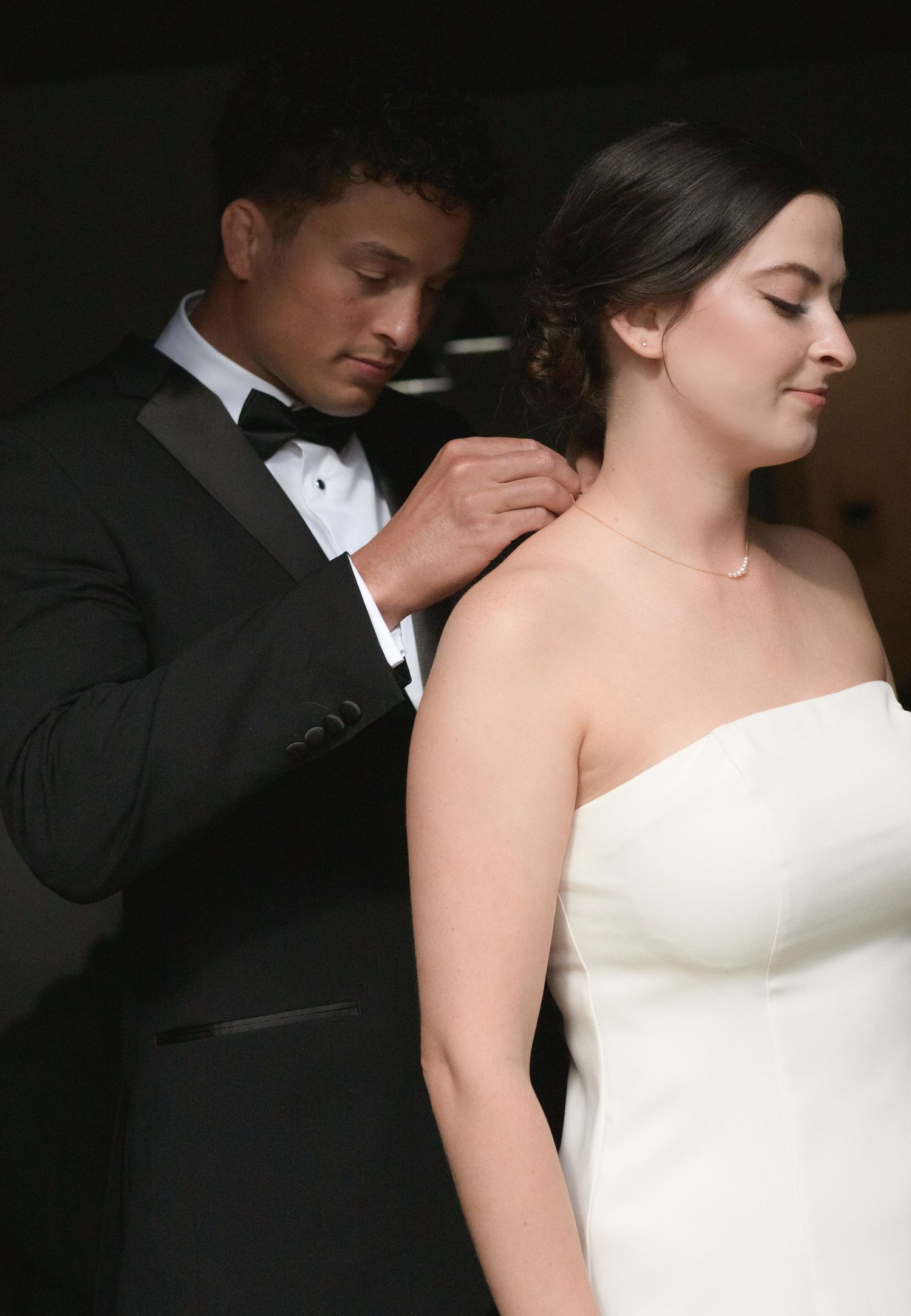 Intimate black and white portrait sequence of couple in formal wedding attire.