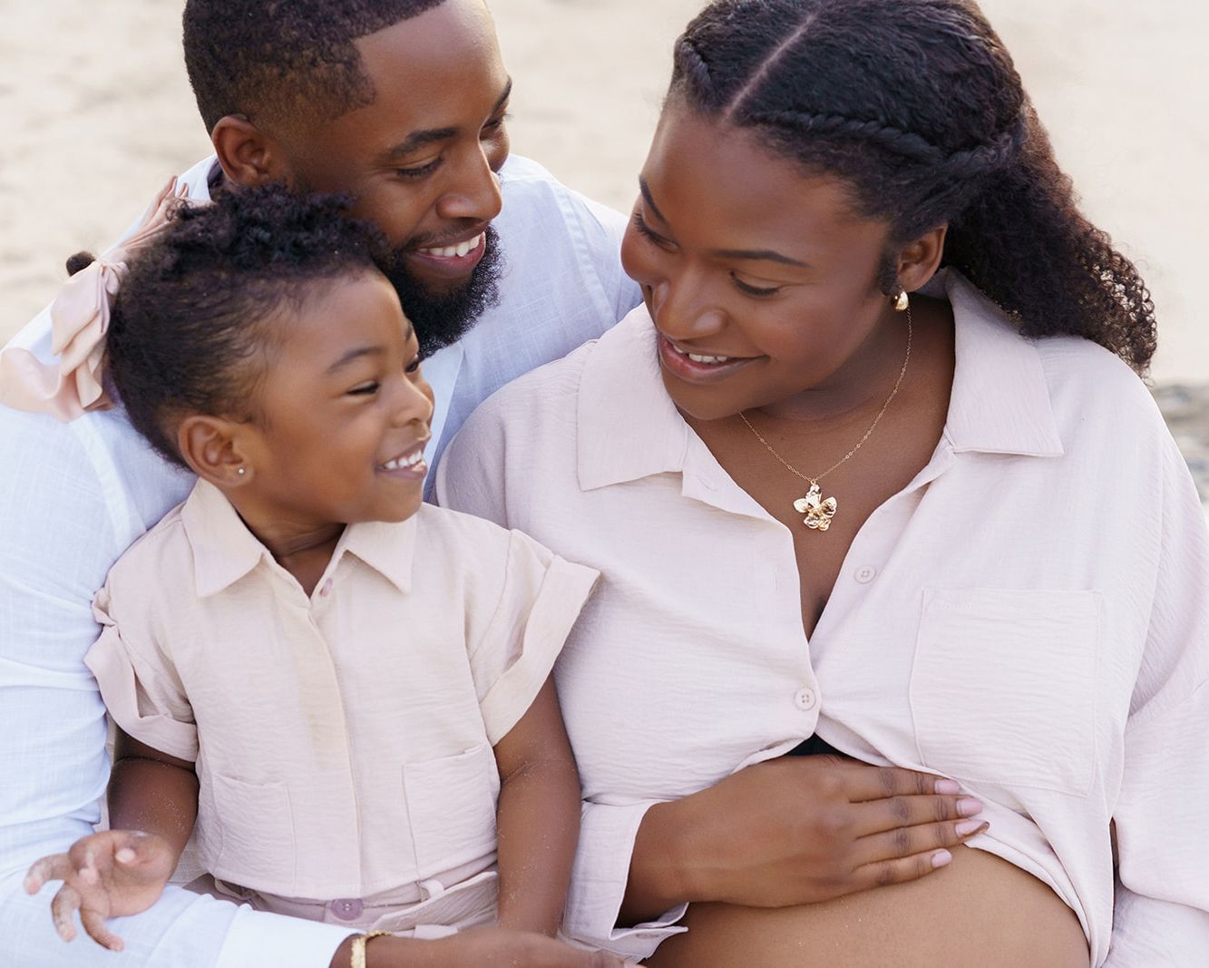 Expecting family sharing a beautiful moment together