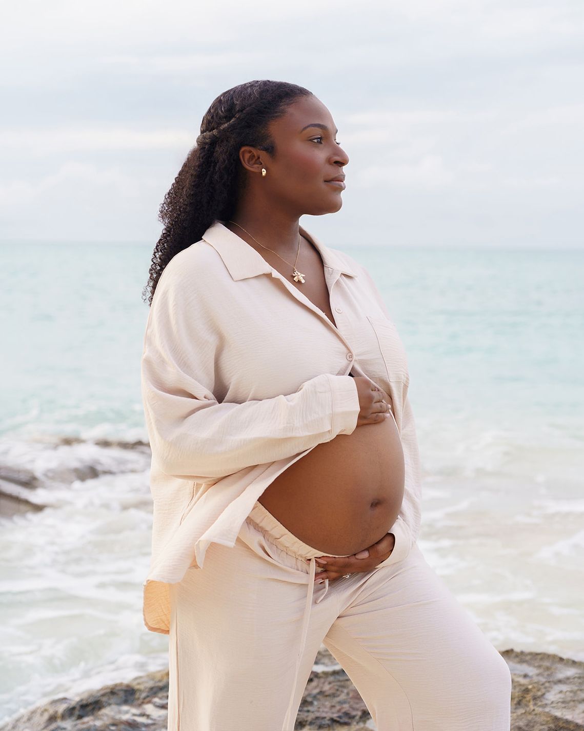 Expecting mother photographed by the ocean in Nassau