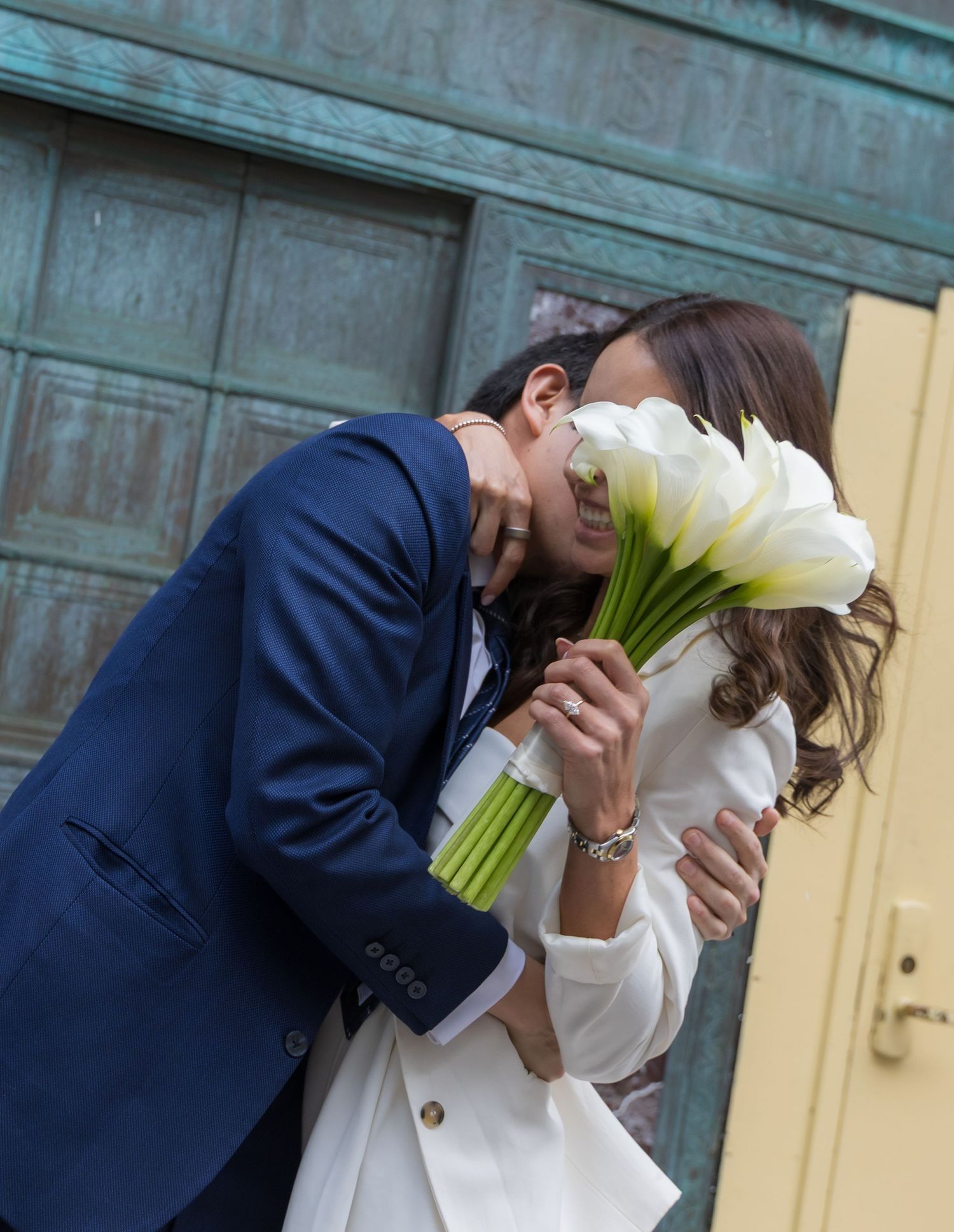 Couple celebrating being just married in front of the NYC Marriage Bureau