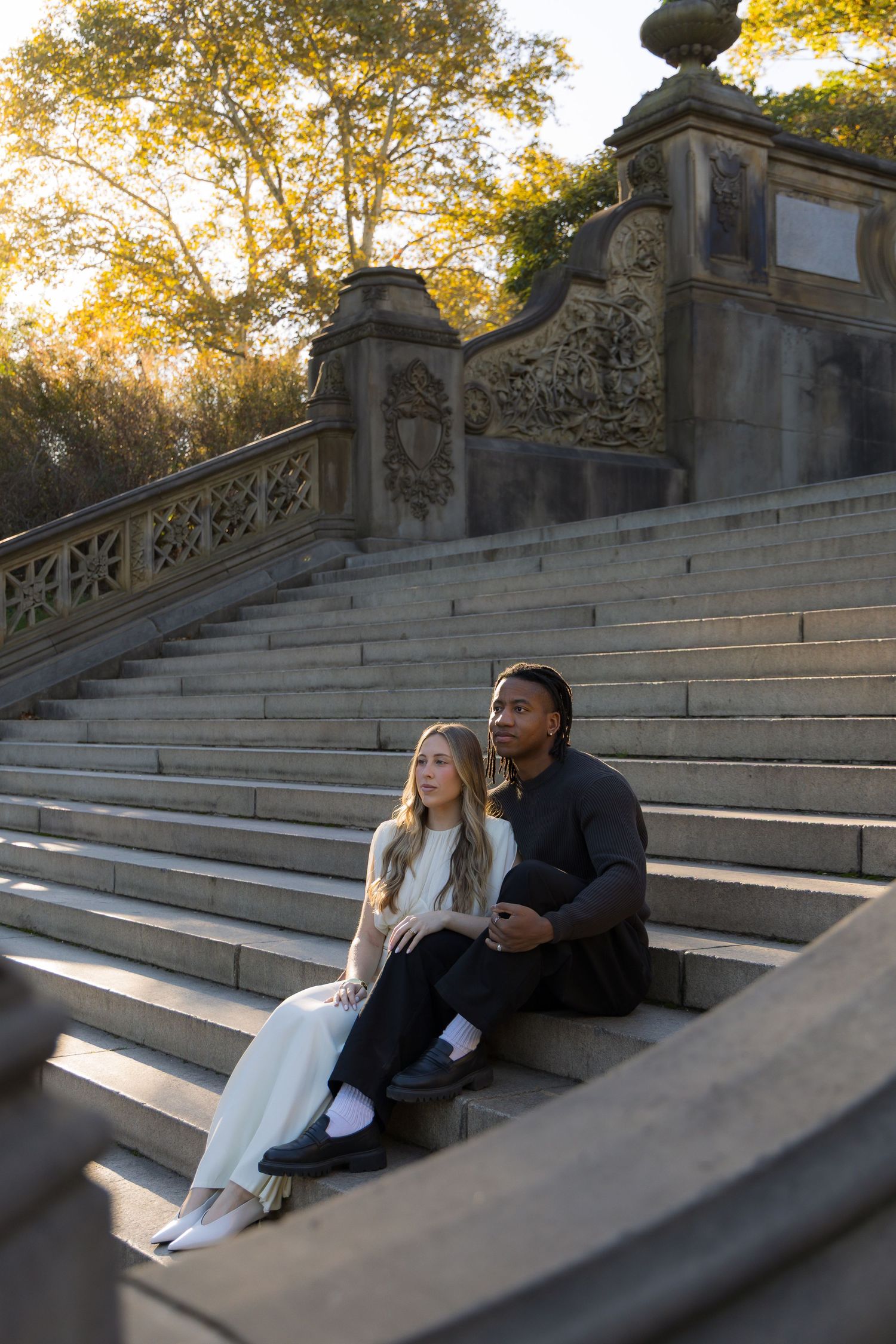 A couple photoshoot at Bethesda Terrace steps during the morning sunlight.