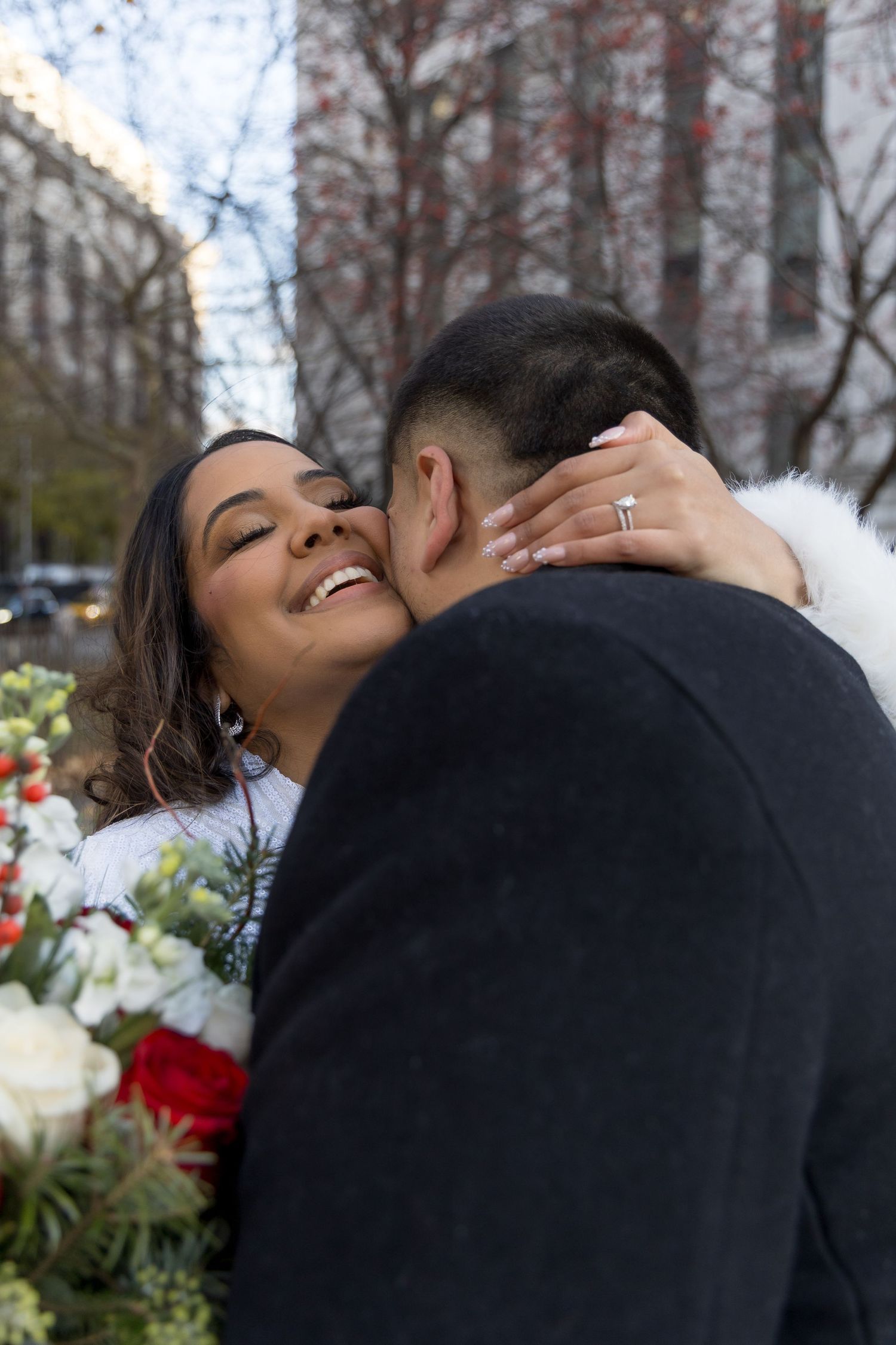 Intimate couple portrait at Wedding Garden with the New York Supreme Court towering in the background