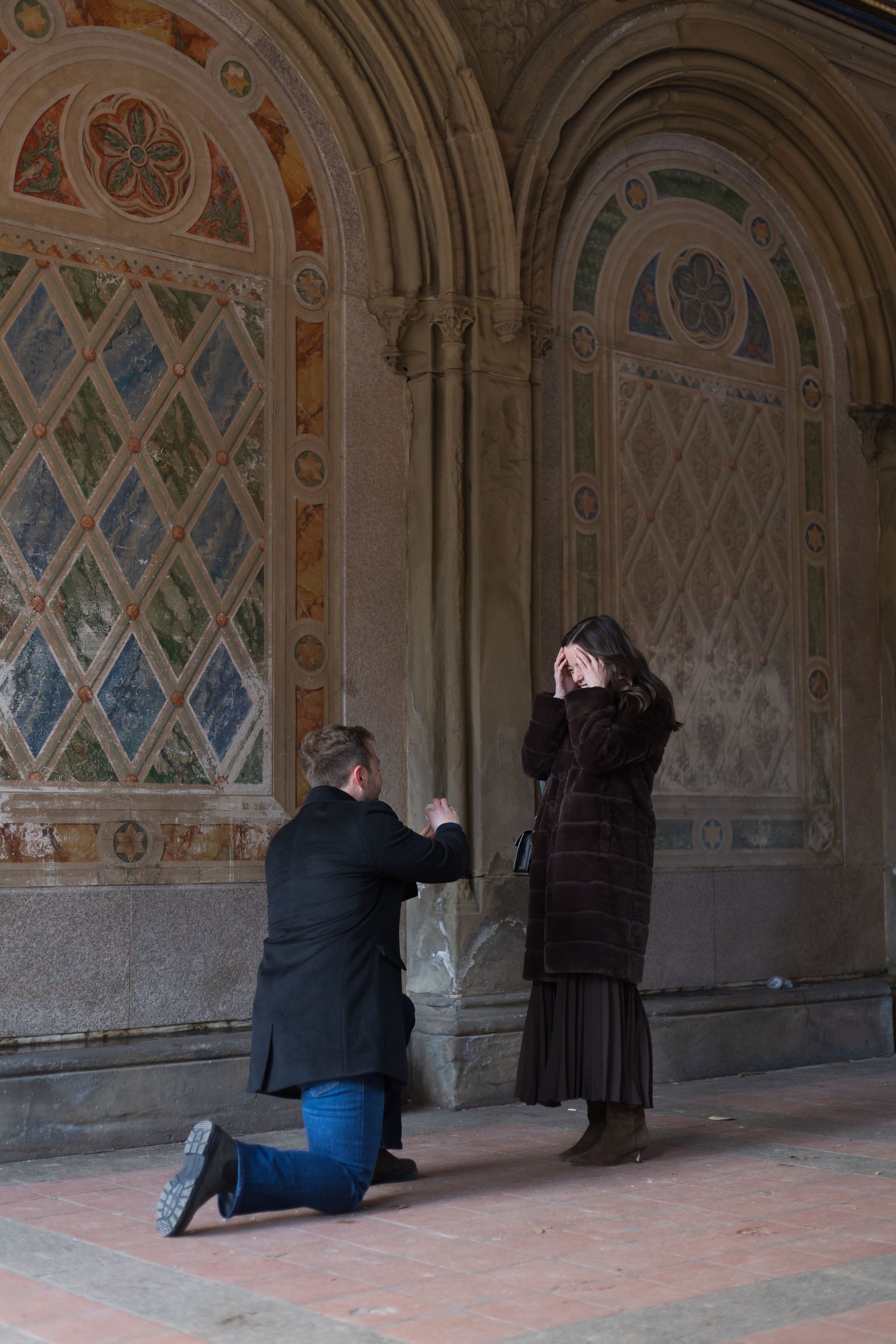 Surprise marriage proposal under the Minton tiles at Bethesda Terrace in Central Park NYC.