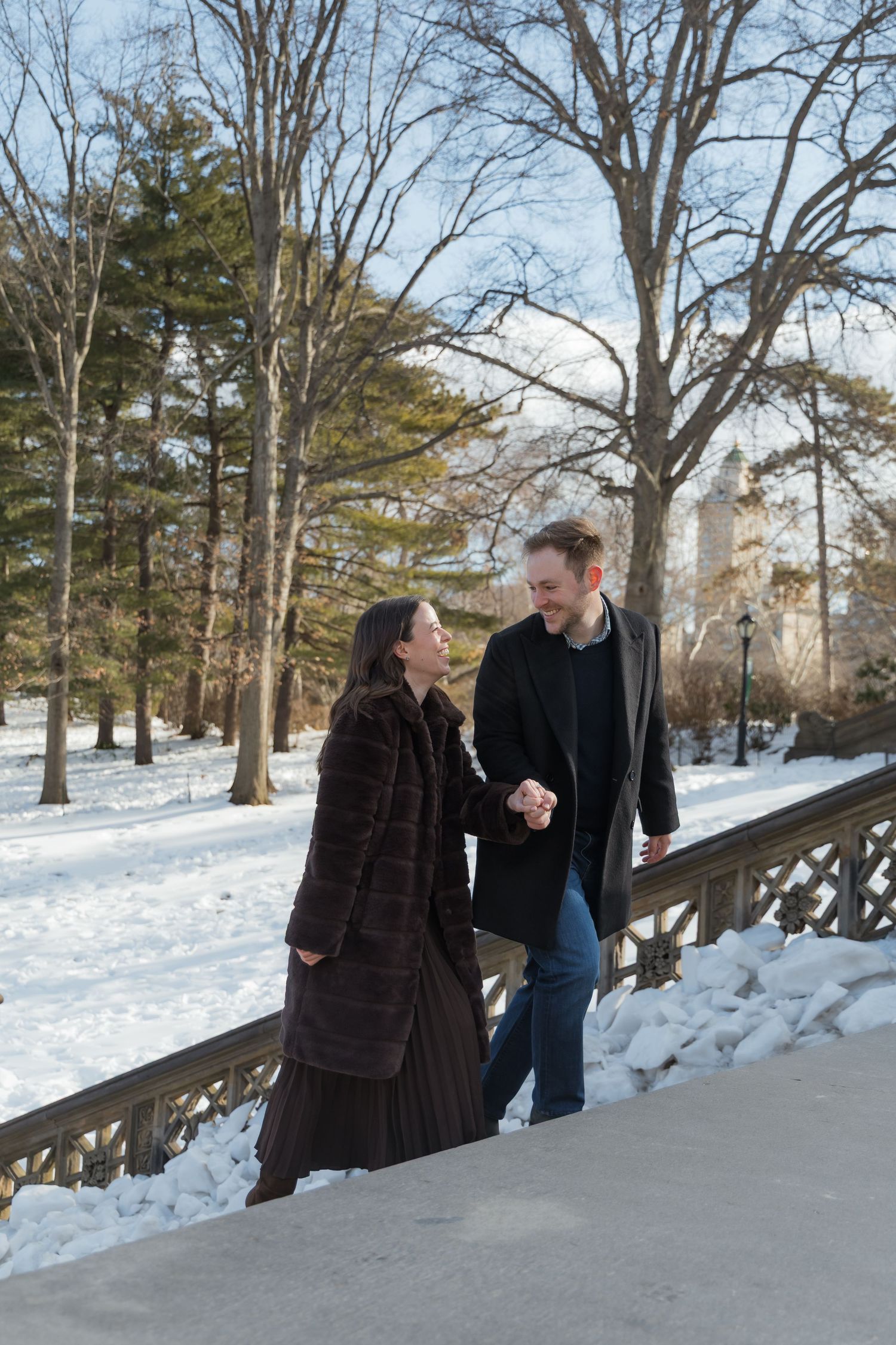 A couple walking up the steps of the Bethesda Arcade in Central Park.