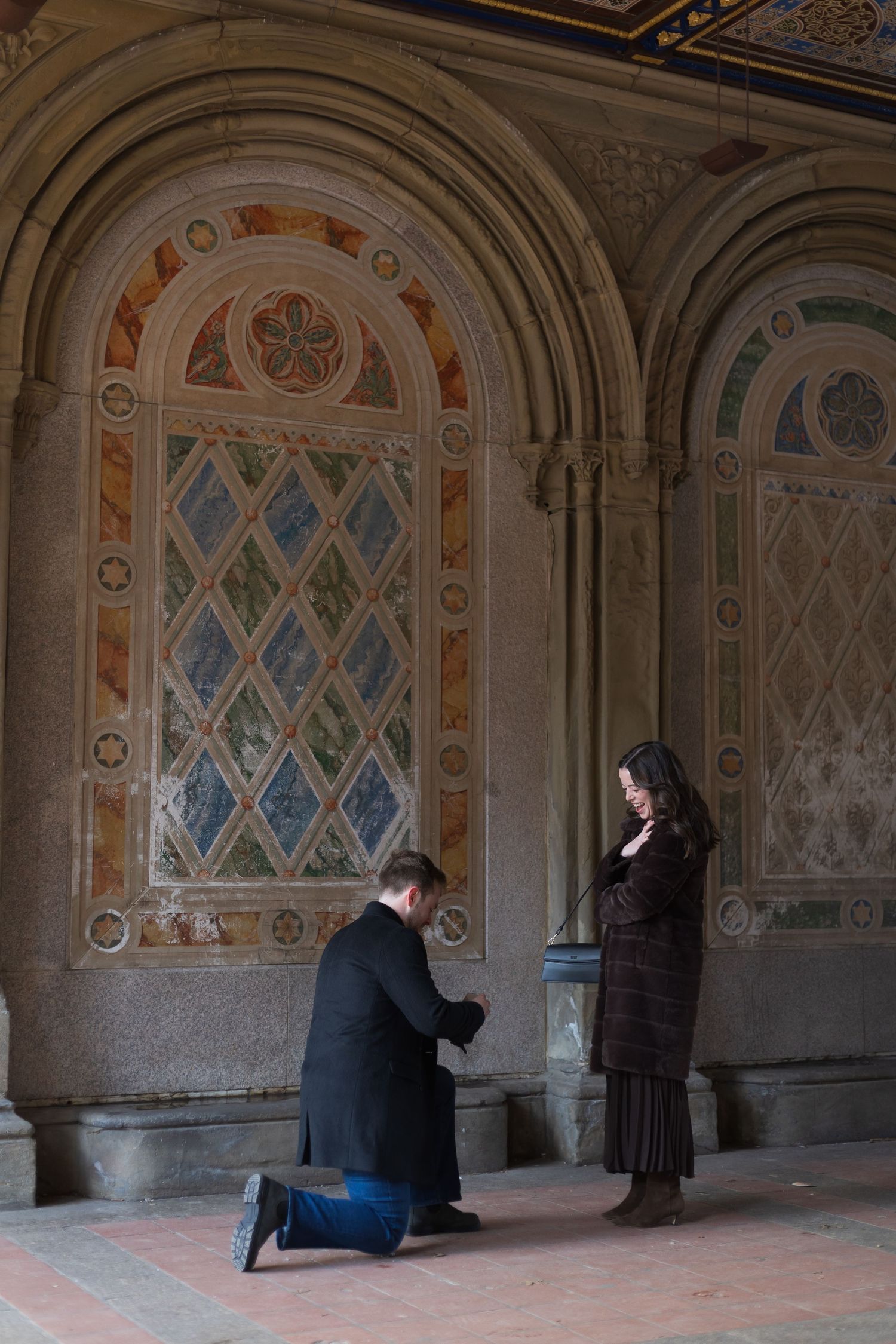 Surprise marriage proposal under the Minton tiles at Bethesda Terrace in Central Park NYC.