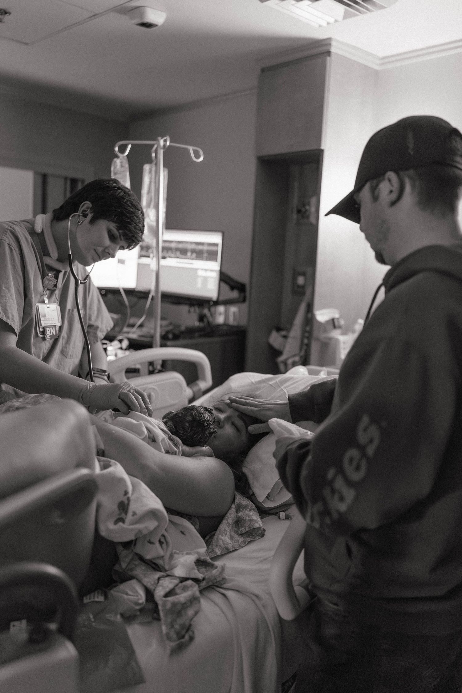 Black and white photos show medical staff providing care to a patient in a hospital room.