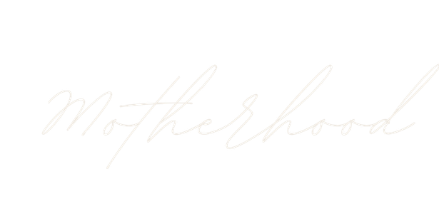 Elegant cursive script spelling Motherhood in delicate white lettering on a clean white background.