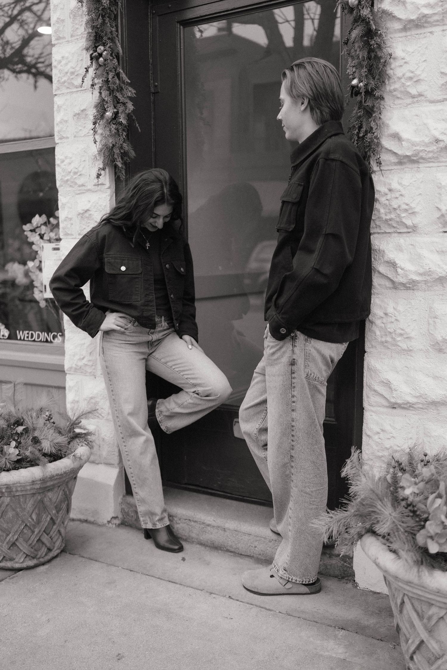 A series of black and white images showing people climbing up steps and entering through a doorway.