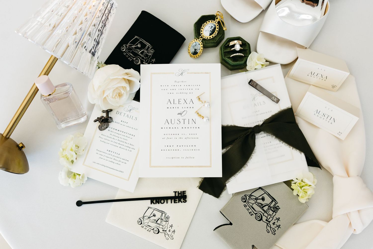 Wedding stationery and accessories flatlay with white and gold details.