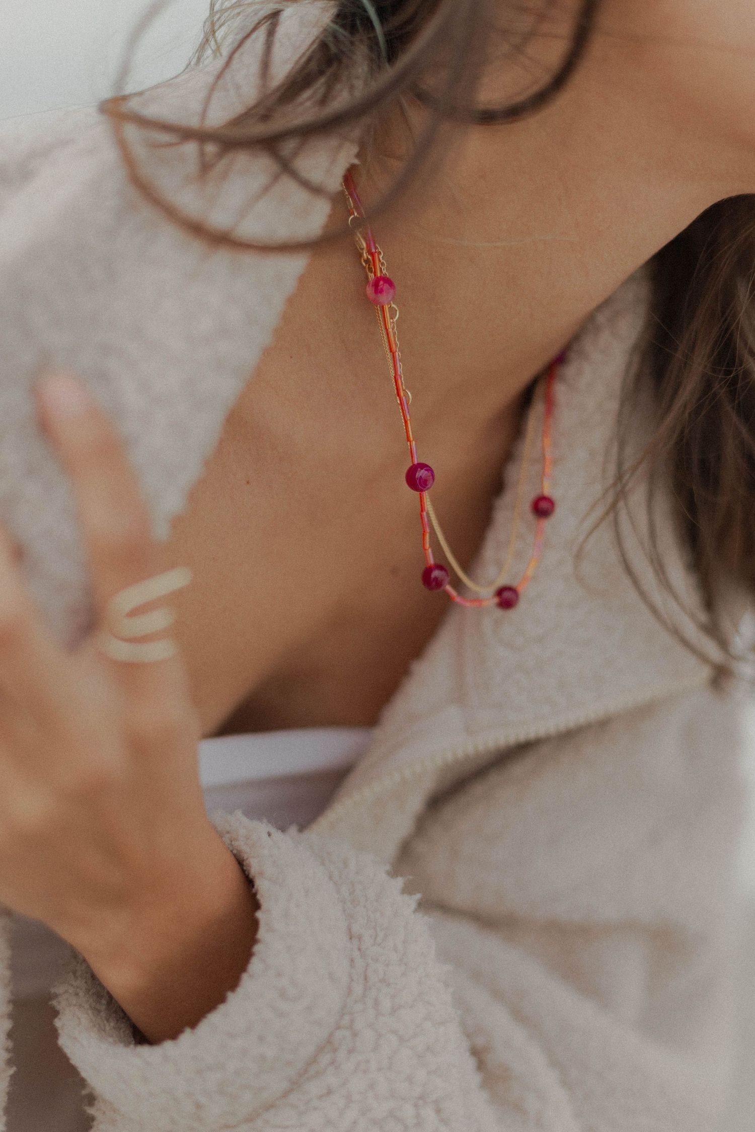 hispanic woman poses for jewelry business branding product photo session
