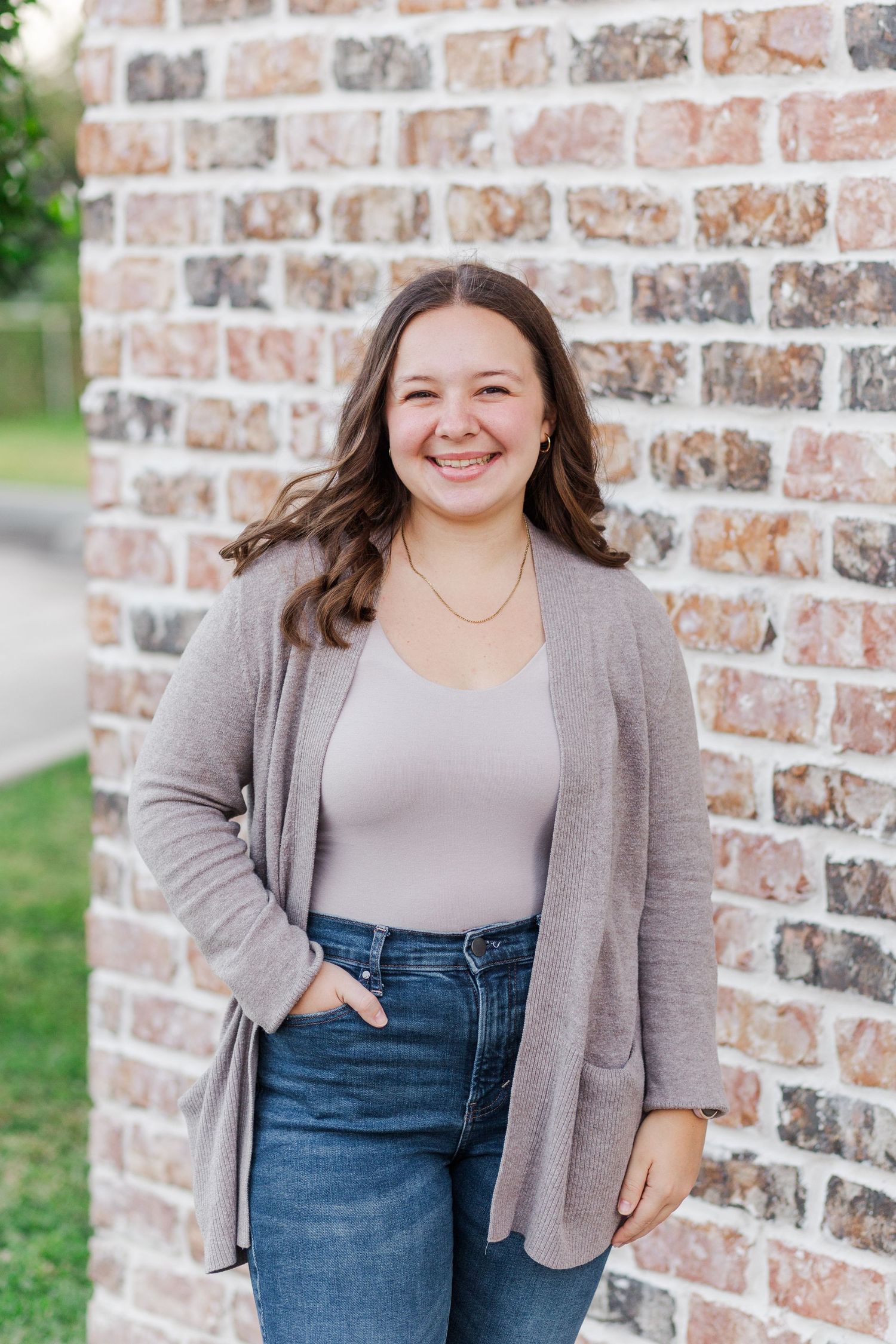 white woman with brown hair poses for headshot in friendswood Texas for author branding photoshoot