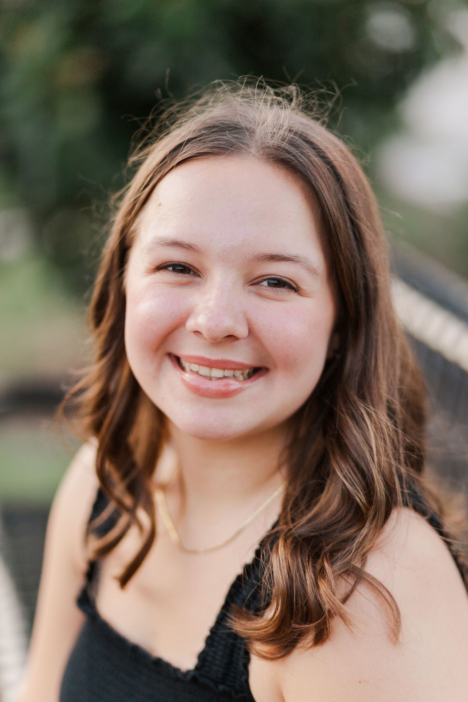 white woman with brown hair poses for headshot in friendswood Texas for author branding photoshoot
