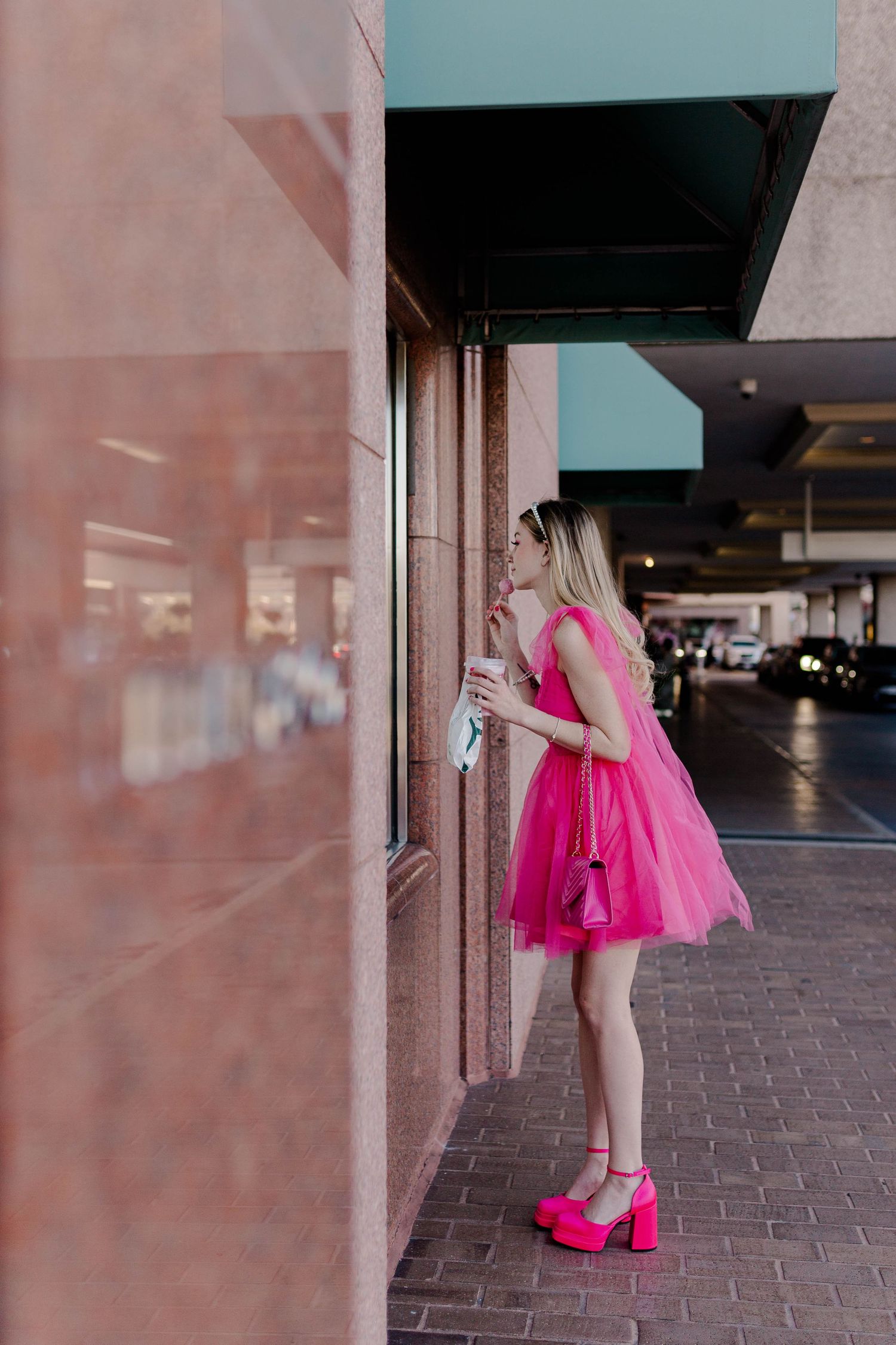 blonde model in hot pink dress and heels in front of Tiffany & Co at the Galleria in Houston, Texas for a barbie themed photoshoot