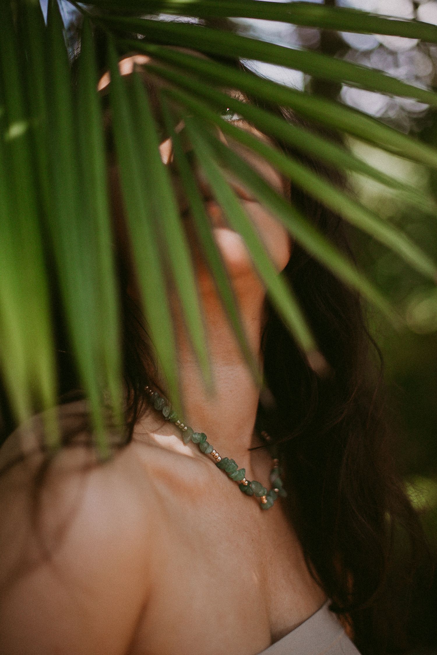 white woman poses with jewelry for a branding photoshoot for a jewelry business in Houston Texas