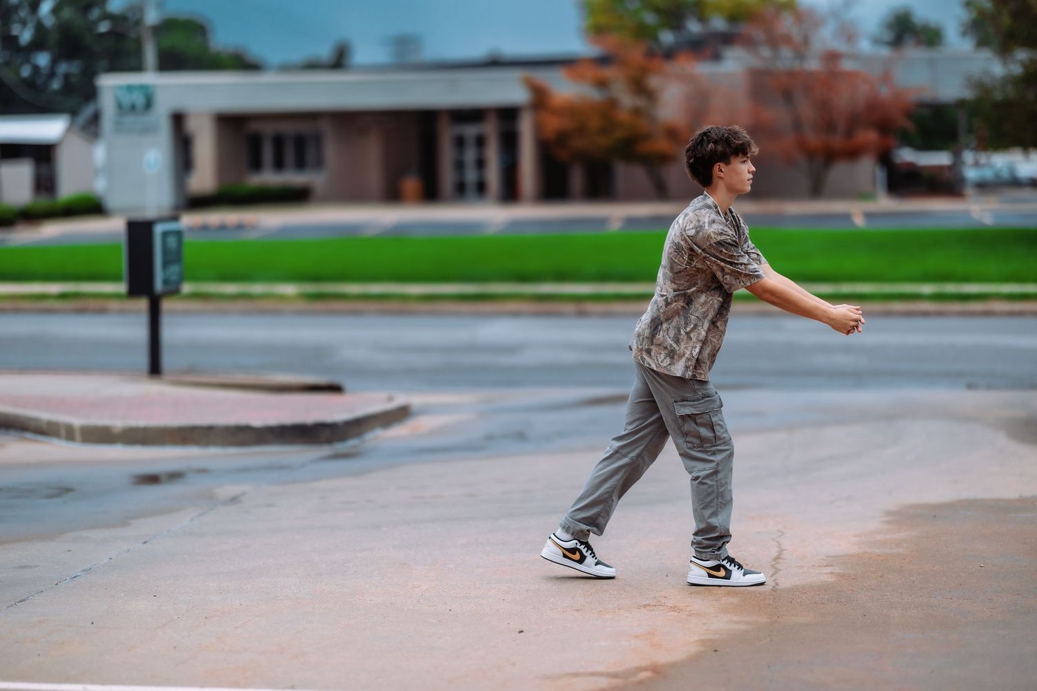 Sequence of skateboarding trick attempts at a concrete skate park with autumn trees in background.