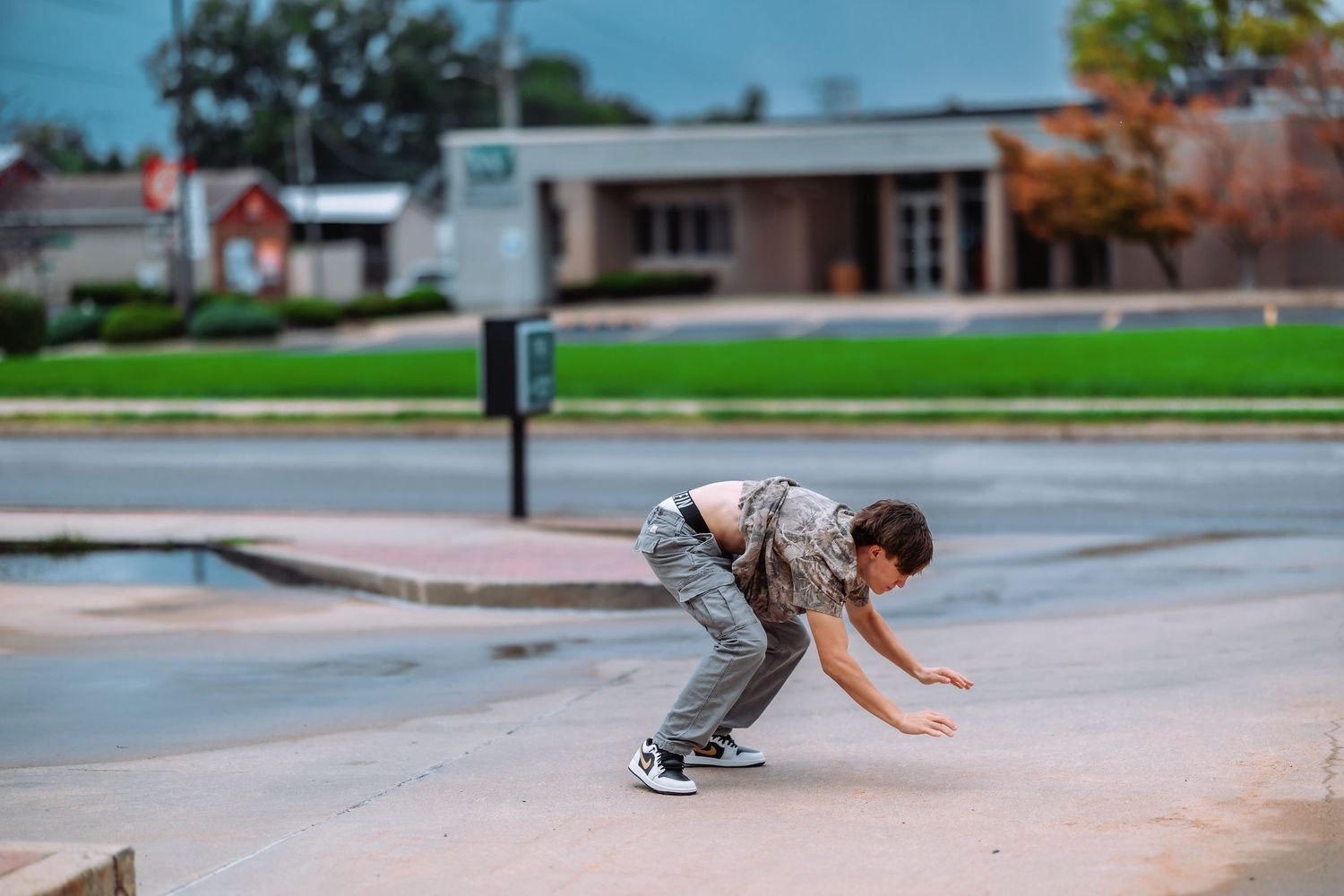 A sequence of skateboarding trick frames showing a kickflip maneuver performed on a concrete surface.