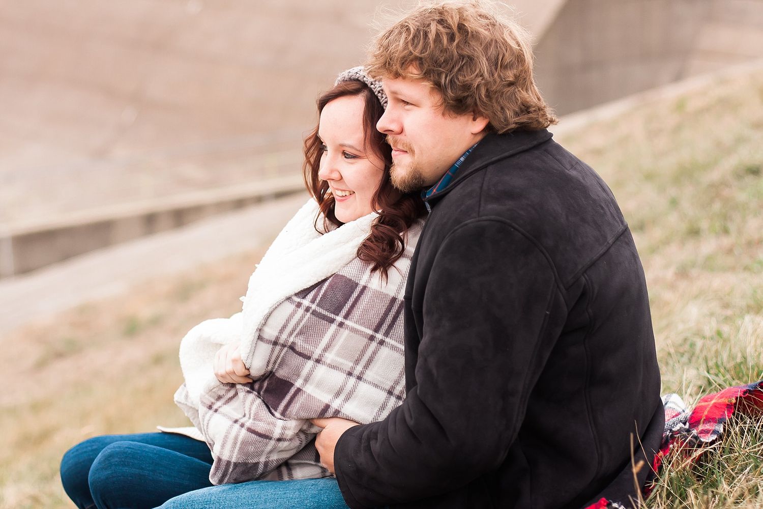 Engaged couple sits wrapped in blanket at Rend Lake Spillway, Capture Me Kristy Benton Illinois Photographer,