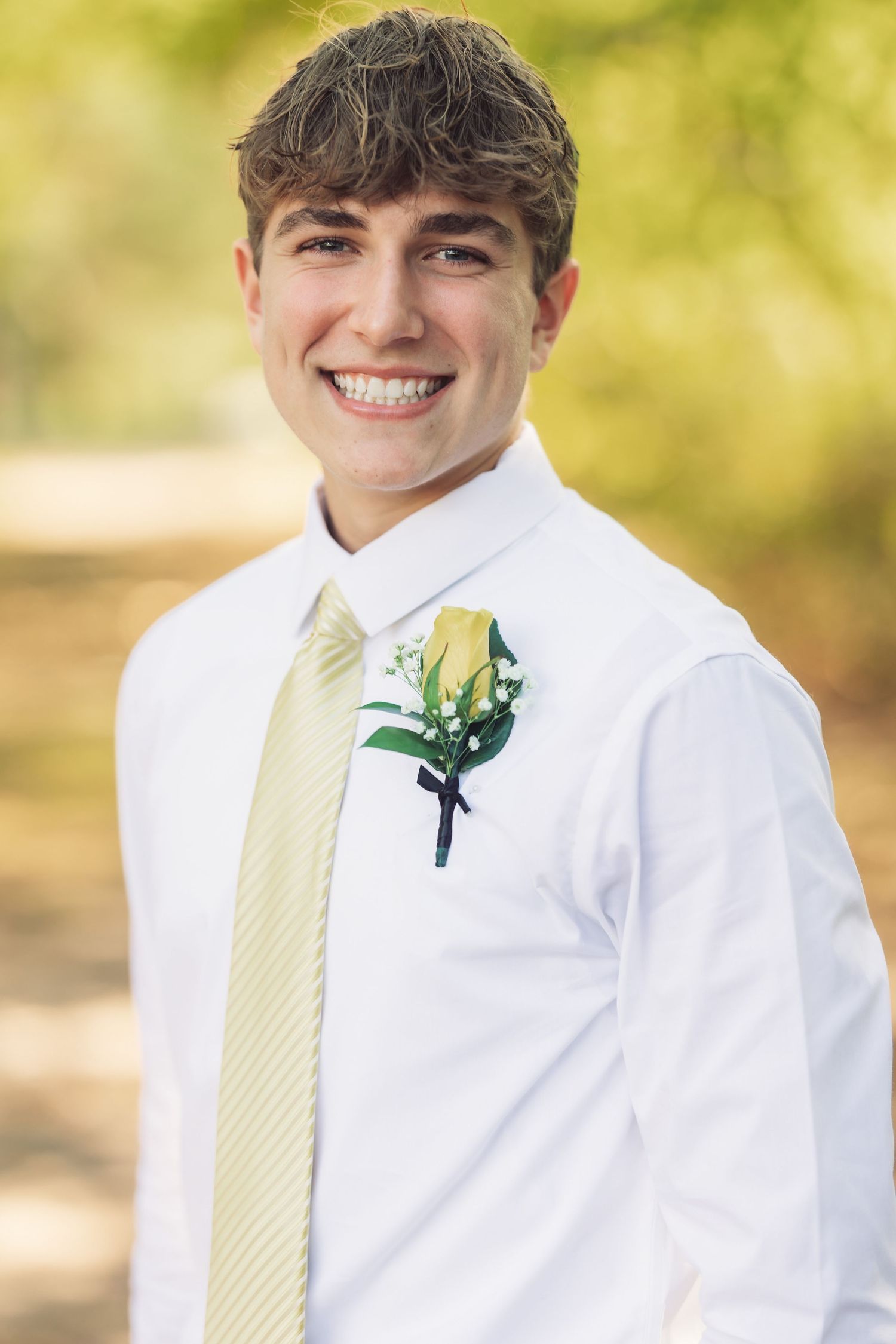 Formal portraits showing white dress shirt and yellow striped tie details.