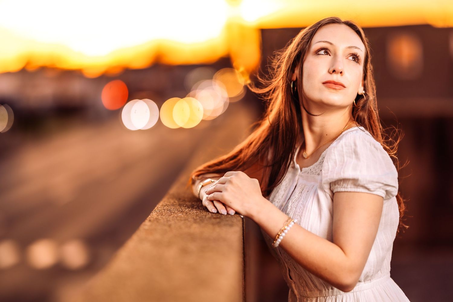 Portrait in warm lighting with bokeh effects and soft focus creating a dreamy atmosphere.