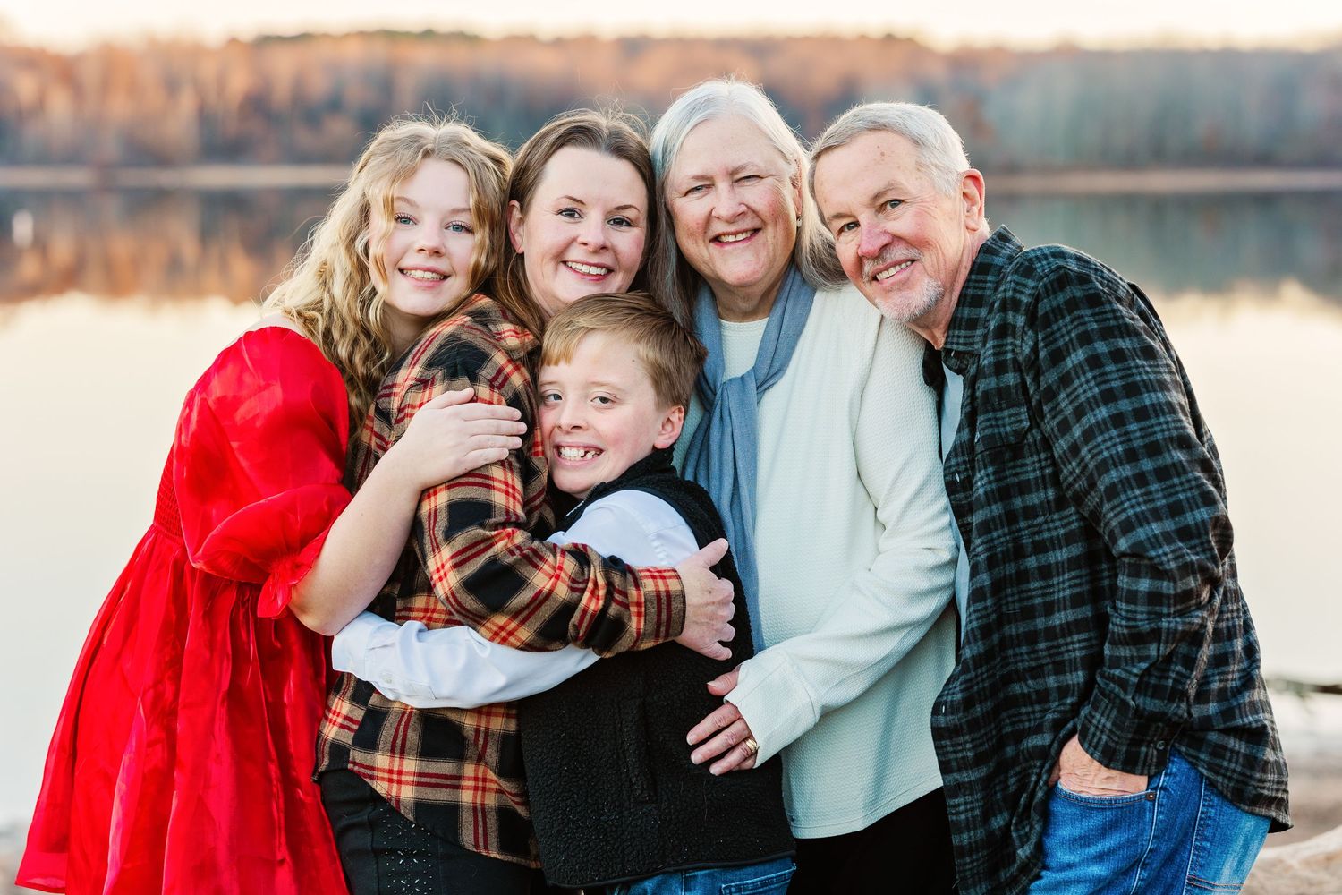 Multi-panel outdoor family photo session at sunset near a lake with warm golden lighting.