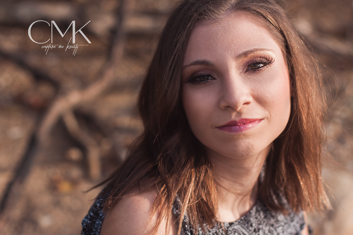 Close up portrait with warm tones and natural outdoor lighting.