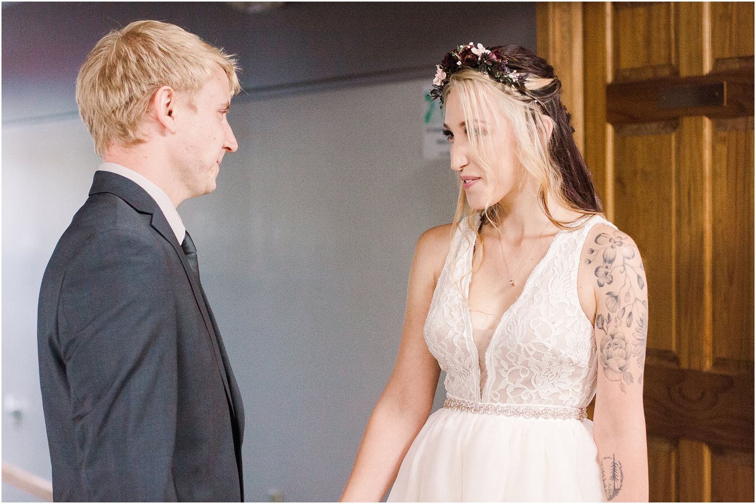 A tender exchange between newlyweds during their first look wedding moment.