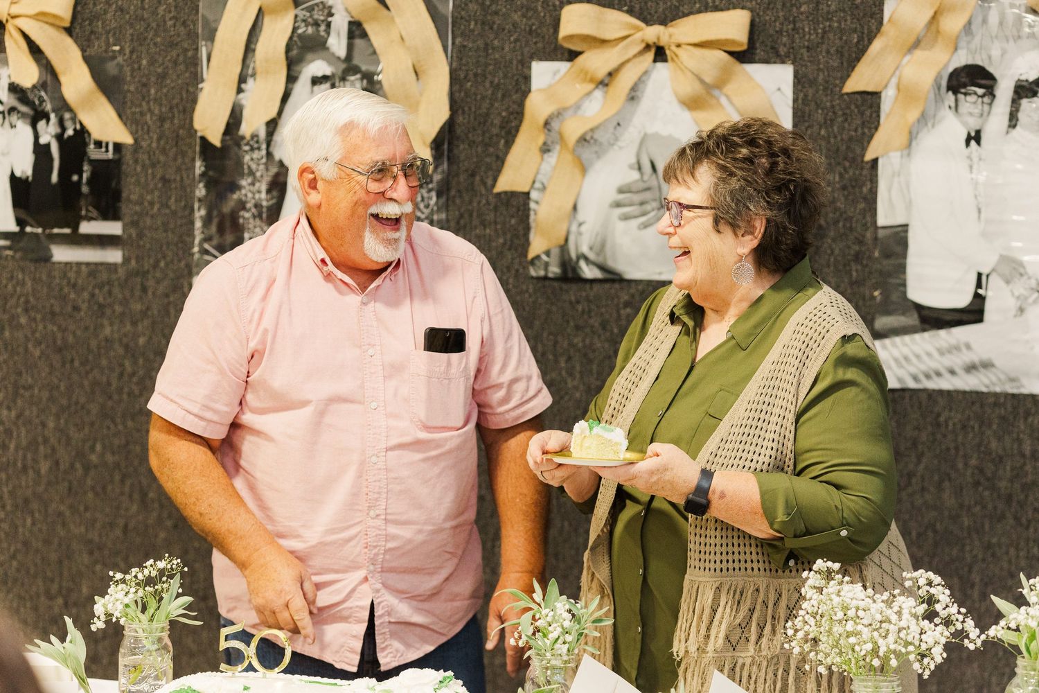 Guests socializing and enjoying conversation at decorated tables during an event.