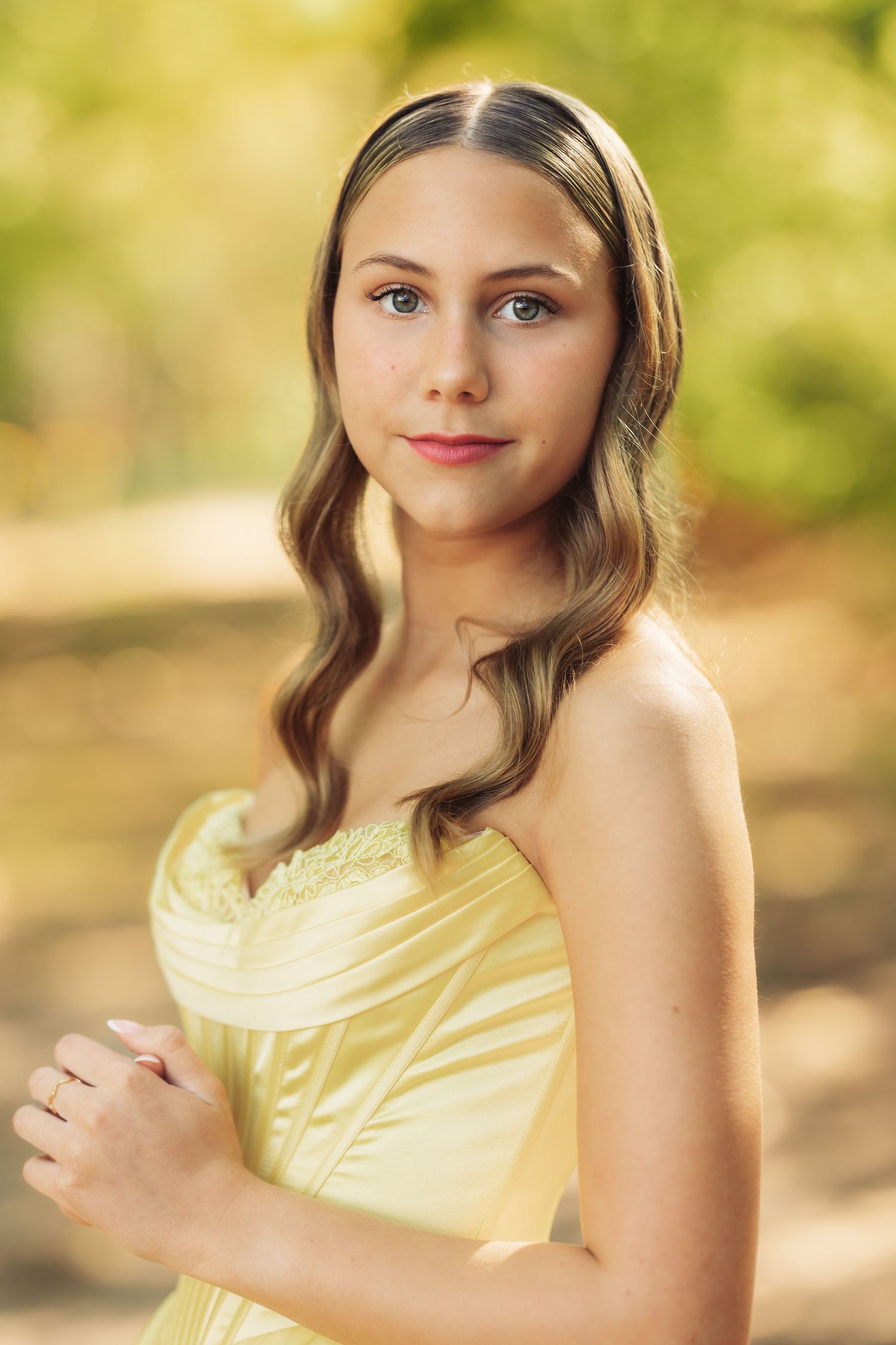 Soft yellow dress shown in multiple portrait style shots.