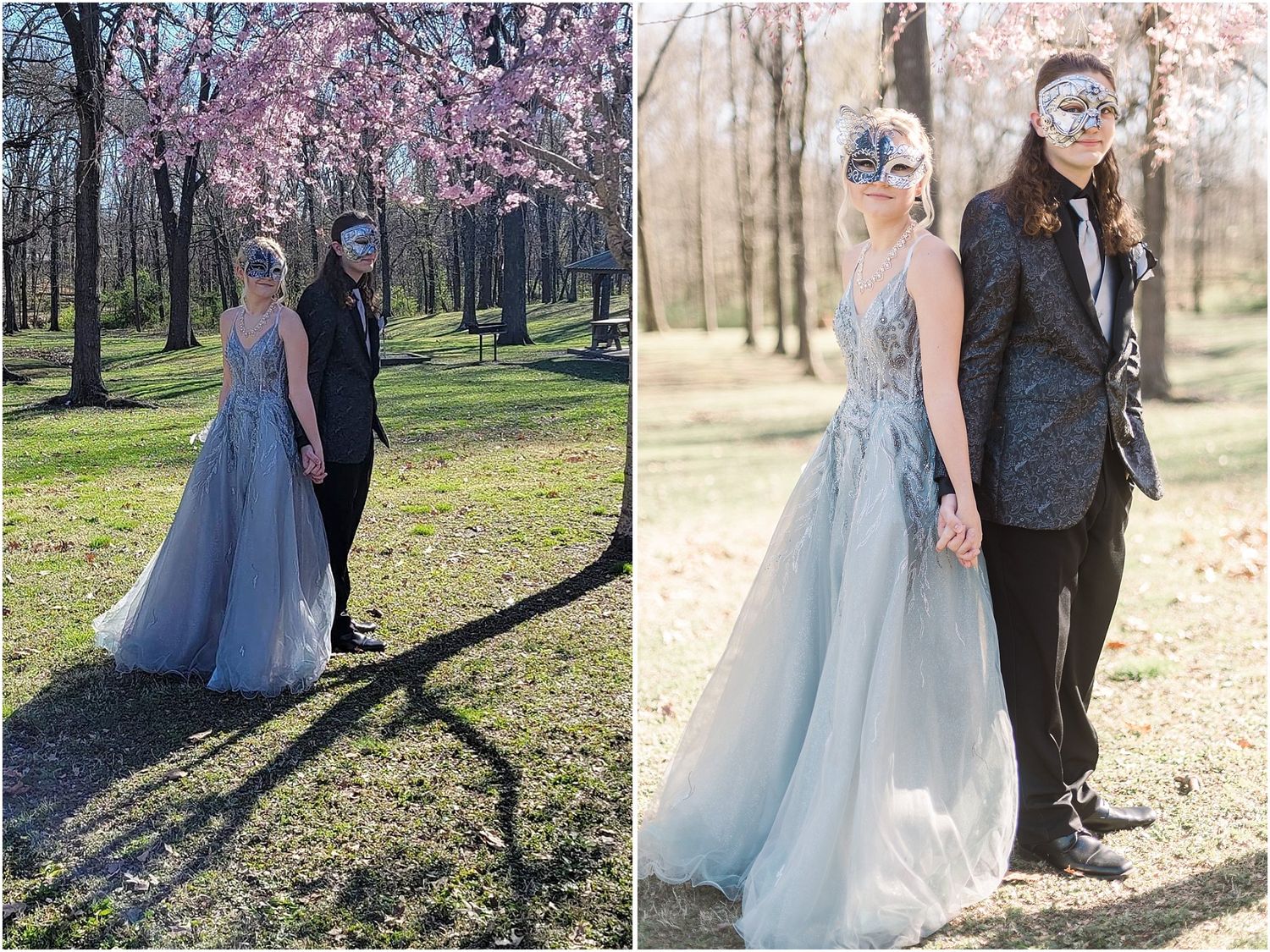 Formal couple poses in matching blue and black attire under blooming spring trees.