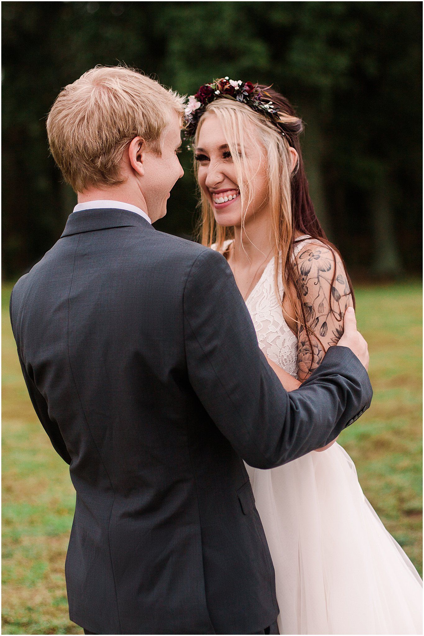 Candid moment of newlyweds laughing together during their outdoor photo session.