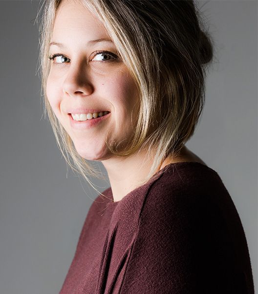 A series of artistic portrait shots showing warm expressions and burgundy sweater against a gray backdrop.