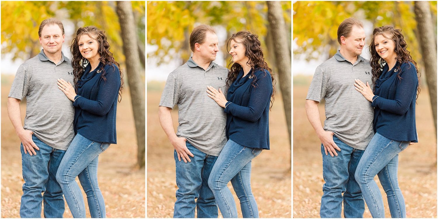 Playful autumn engagement photos with couple laughing against golden foliage.