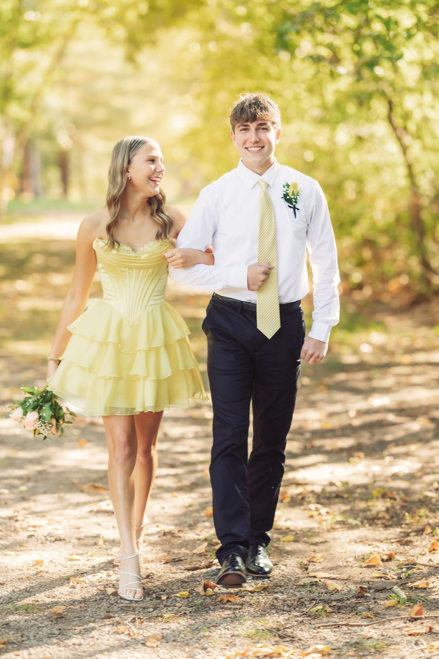 Candid walking shots of attendants in yellow dress and formal wear.