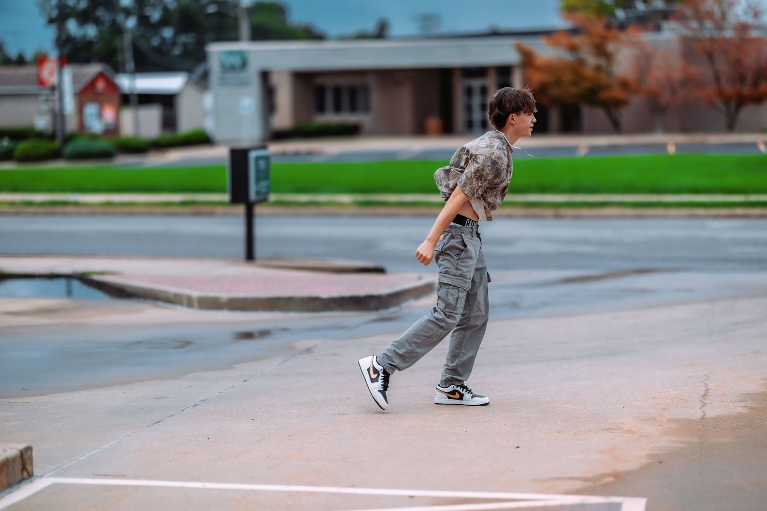 Skateboarding sequence showing progression of an ollie trick on a concrete surface during autumn.