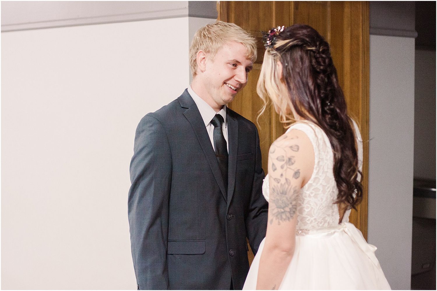 Intimate wedding moment captured between couple sharing joyful expressions.