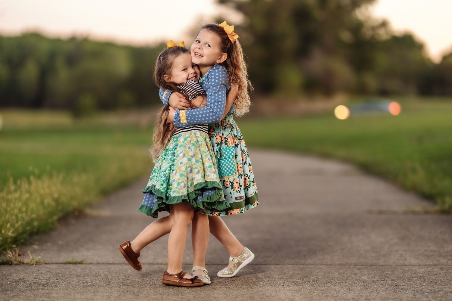 Series of candid moments between two children walking and playing on a path at dusk.