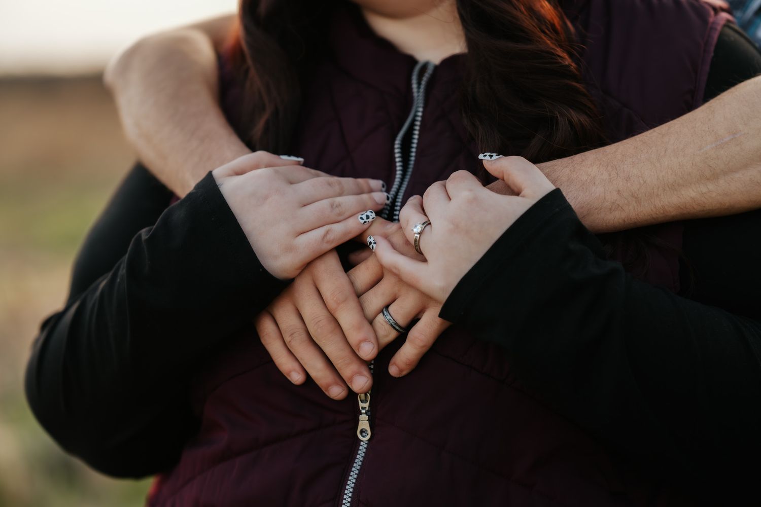 Close-up detail shots of hands touching and intertwining during intimate moment.