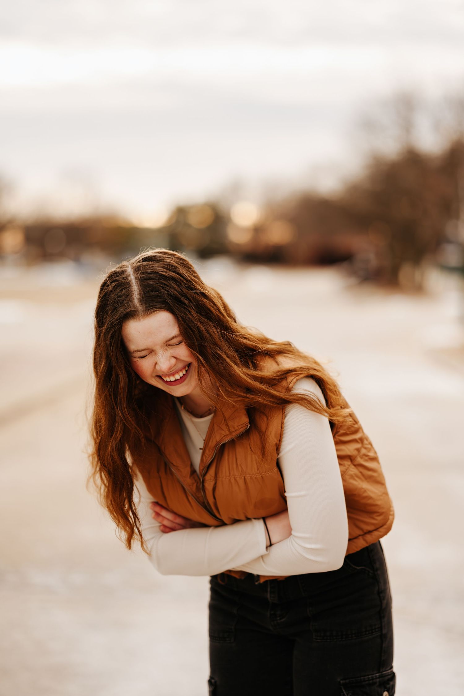 Dynamic portraits showing movement and laughter in warm autumn lighting.