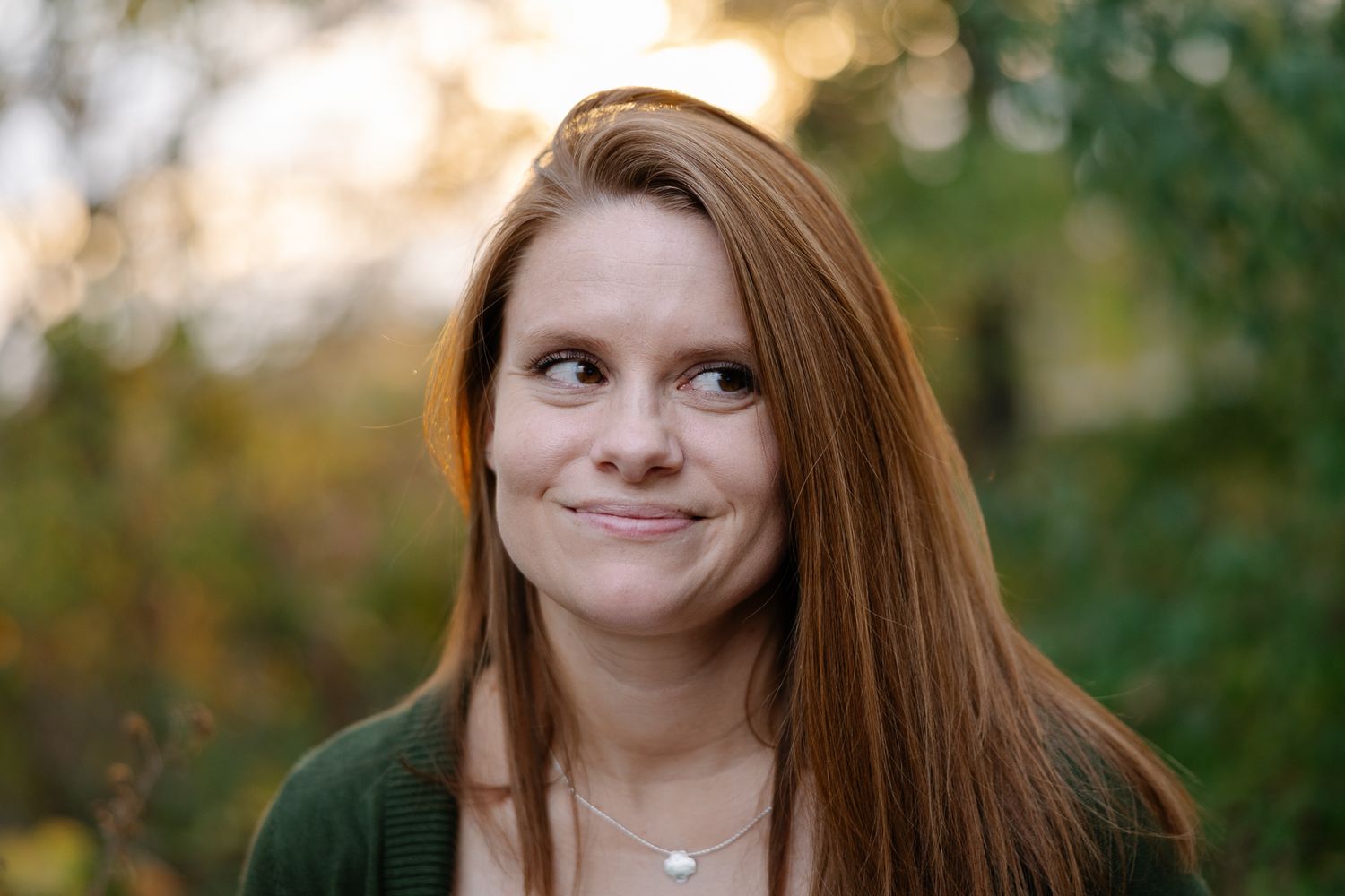 Autumn outdoor portrait with soft natural lighting and bokeh effect.