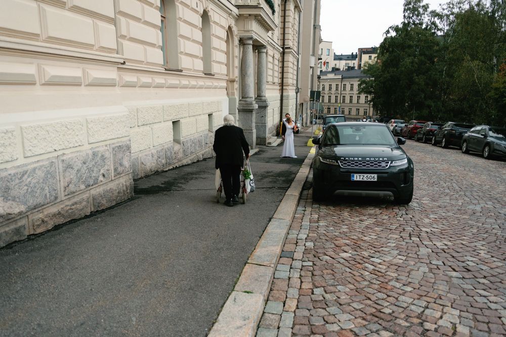 Series of images showing a cobblestone street with parked cars and historic architecture.