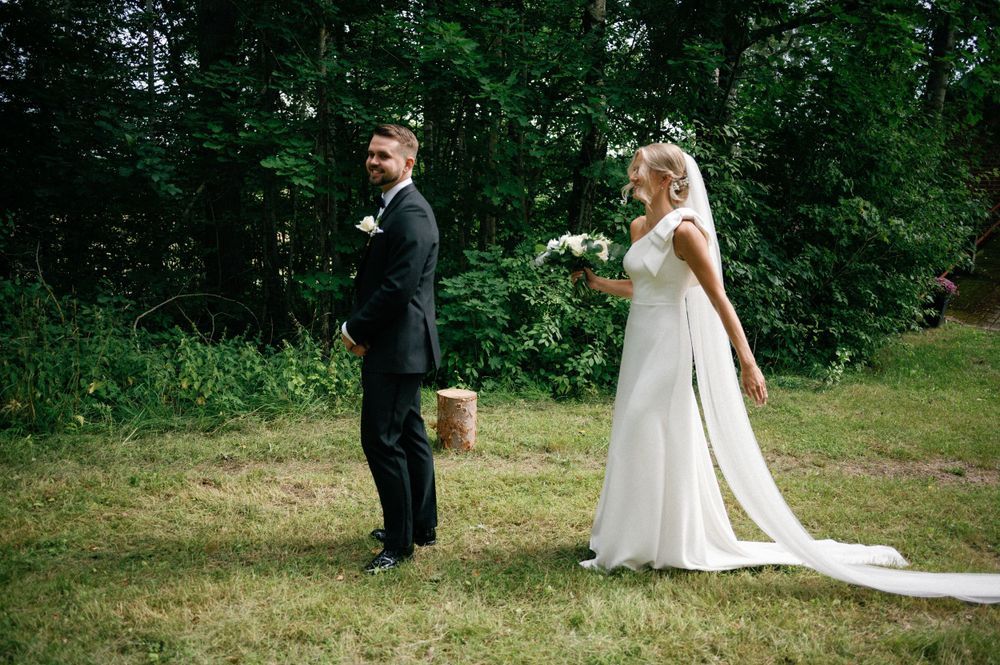 Outdoor wedding ceremony moments captured along tree-lined path.