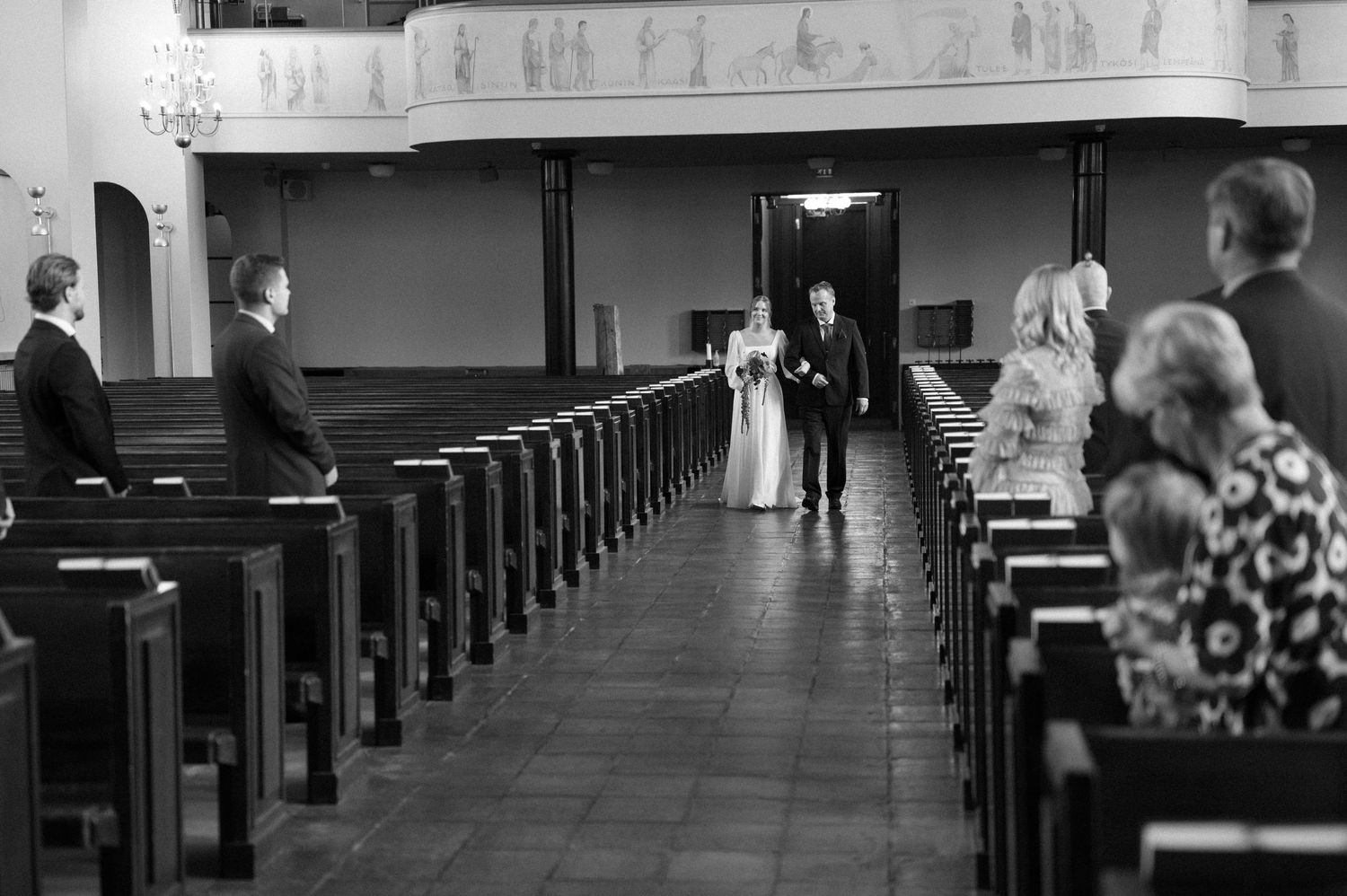 A series of black and white church pews shown from different angles in a traditional sanctuary interior.