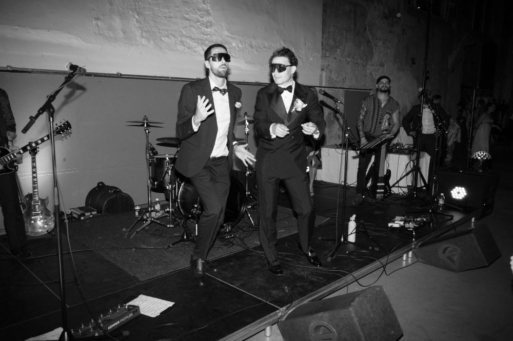 Black and white photos of people dancing energetically at a party or celebration.