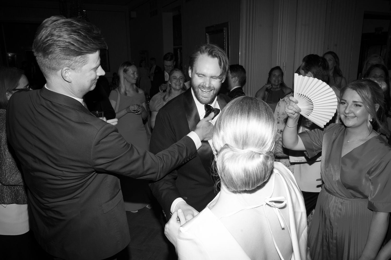 Black and white photographs showing couples dancing together at what appears to be a formal event or celebration.