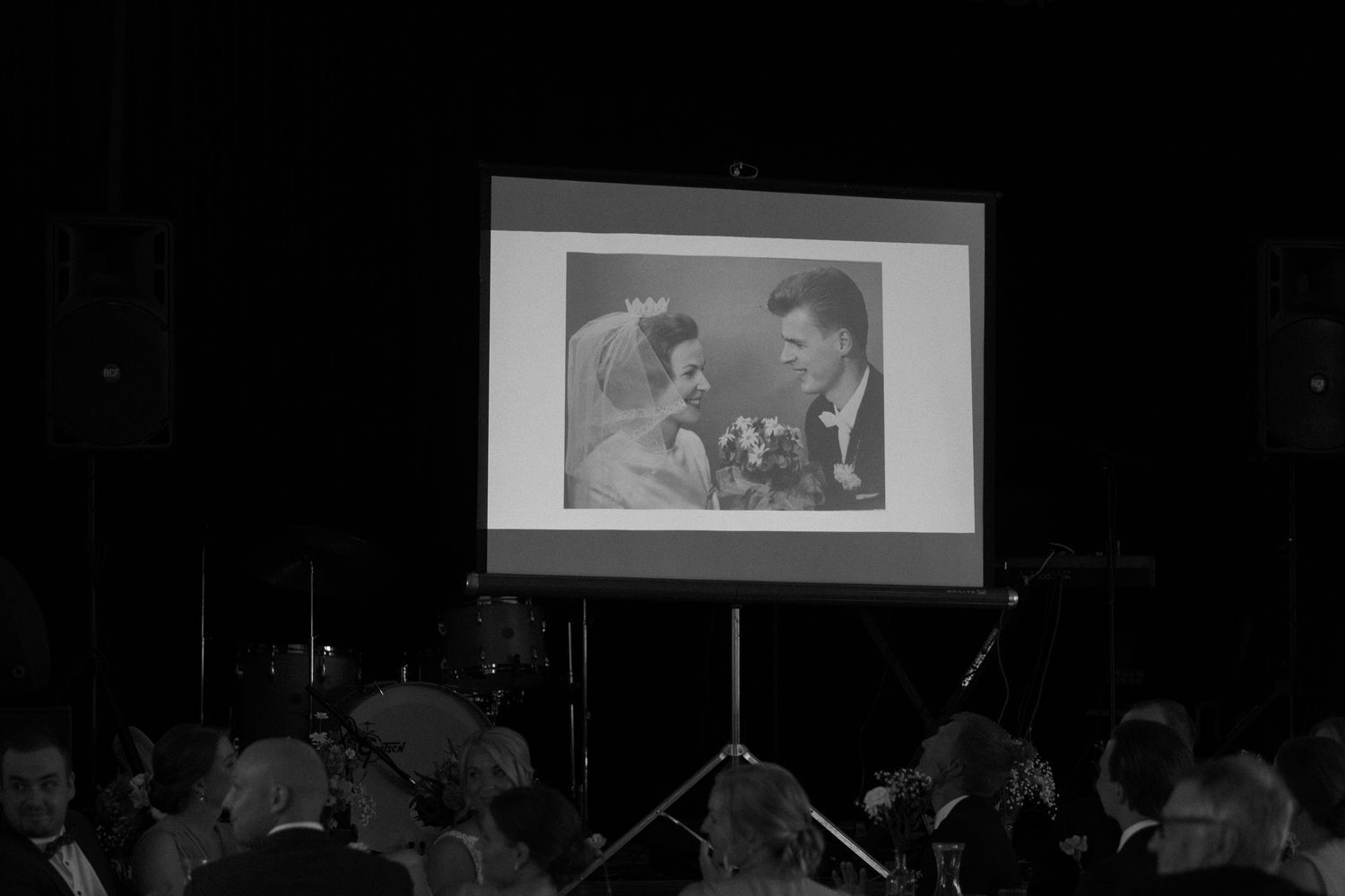 Black and white projection of a vintage photograph at an event.