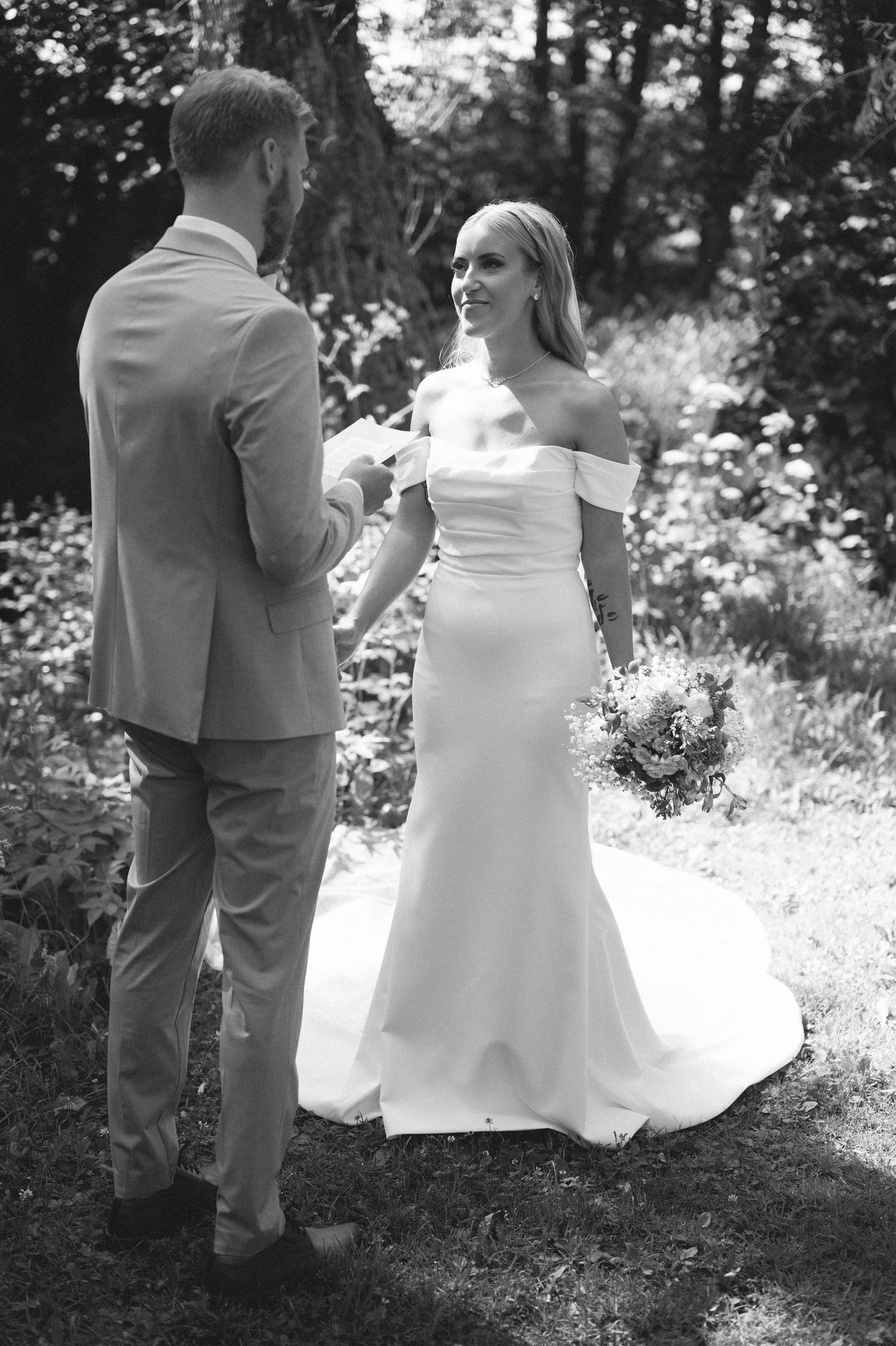 Black and white wedding sequence showing intimate moments in a garden setting.