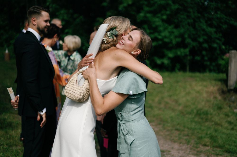 Wedding celebration moments captured outdoors in a natural setting.