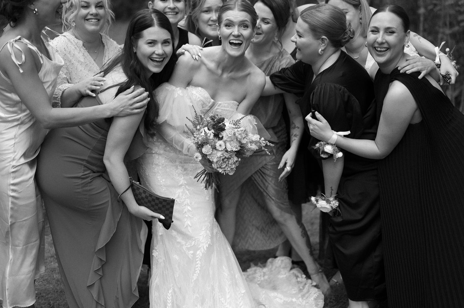 Joyful candid moments captured in black and white during a wedding celebration.